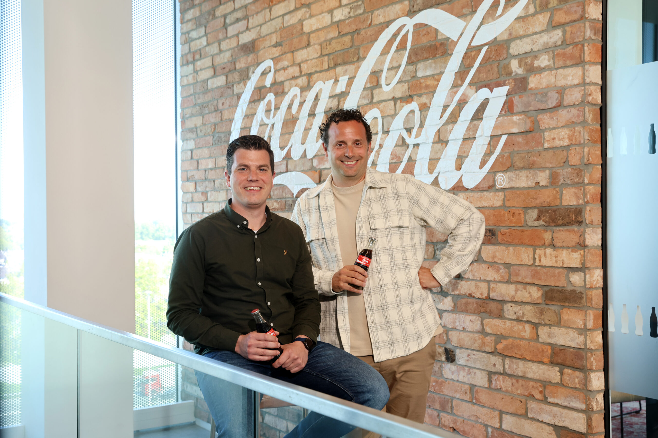 Europacific Partners en Jelle Krikke, Senior Brand Manager Coca-Cola TM bij The Coca-Cola Company en Derk van de Luitgaarden, Associate Director Channel Development & Shopper Activation bij Coca-Cola.